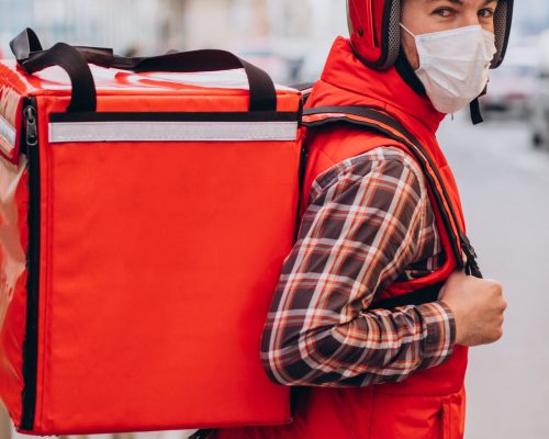 Food delivery man with boxes with food